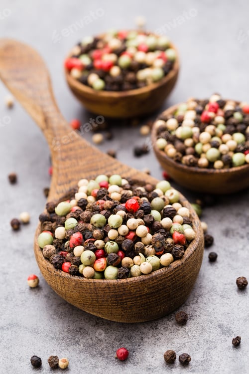 Preview: Peppercorn Mix In A Wooden Bowl On Grey Table.