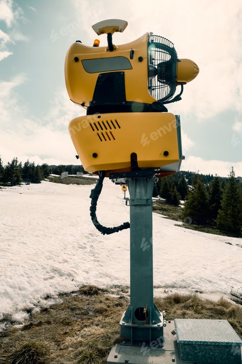 Preview: Snow Gun Machine Waiting For Frost With Sun Flare Background, Snowmaker Machine. Color Effect.