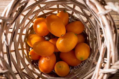 Preview: Kumquat Berries On Wooden Background. Citrus Fruit Ingredient Food.