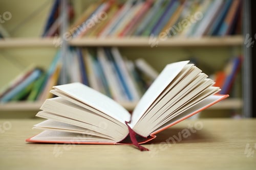 Preview: Open Book On The Table In Library