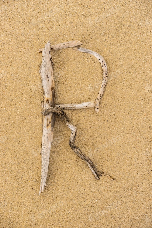 Preview: Sand Beach Letters Alphabet, Letter R Written With Driftwood.