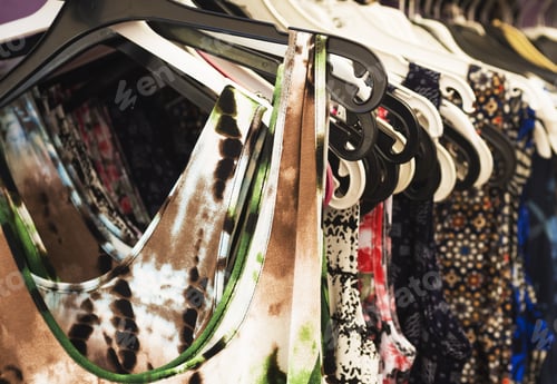 Preview: On Plastic Hangers On The Market A Collection Of Colored Women'S Dress