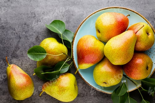 Preview: Fresh Bio Pear With Leaves On The Plate. Gray Stone Table.