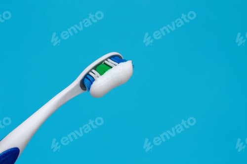 Preview: Toothpaste On A Toothbrush Closeup, Background With Place For Text