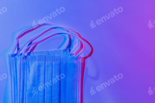 Preview: Medical Surgical Masks In Club Neon Light. Abstract Background Of Cyber Colors Of Night Streets