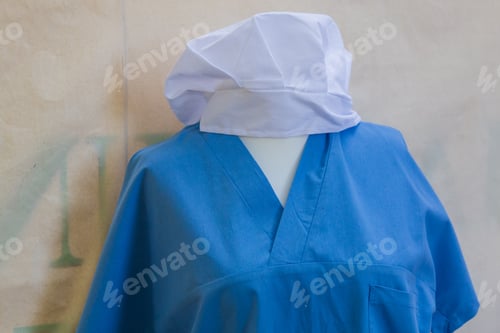 Preview: Medical Scrubs and Cap on Display