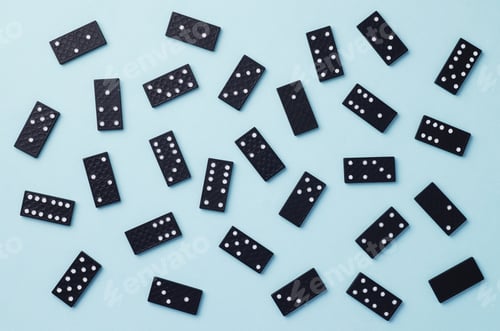 Preview: Domino Pieces Disorganized Over Blue Background, Top View