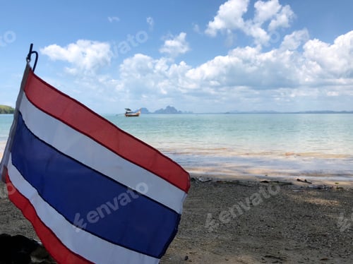 Preview: Thai Flag With A Long-Tail Boat In The Background At Koh Mook Thailand
