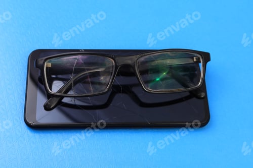 Preview: Broken Glasses And Smartphone. Selective Focus. Background