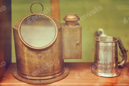 Preview: Old Ship Deck Lamp And Metal Mug, Close-Up