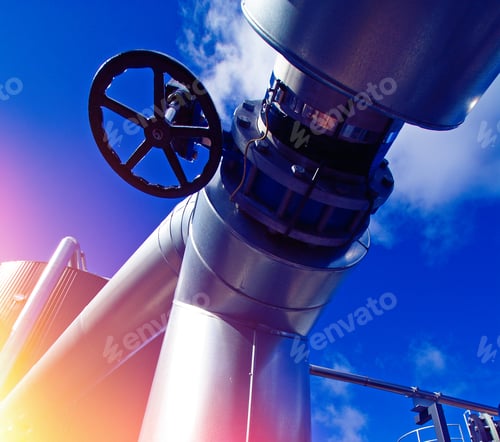 Preview: Industrial Zone, Steel Pipelines And Tanks Against Blue Sky