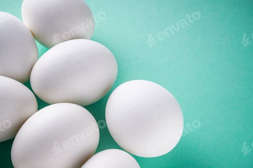 Preview: White Chicken Eggs On Green Pastel Background