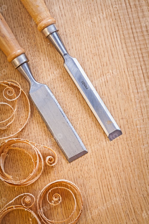 Preview: Carpentery Chisels On Wooden Board With Wooden Shavings