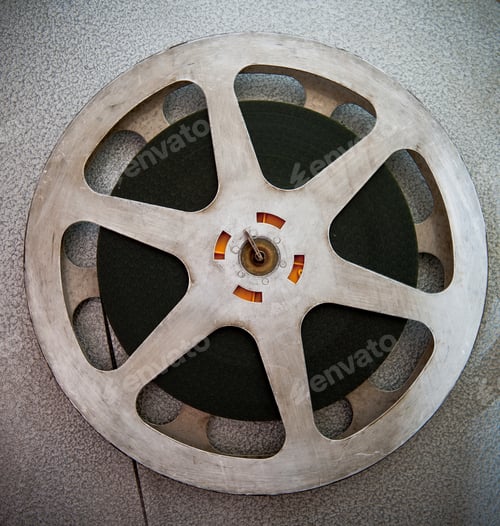Preview: Movie Reels Part With Filmstrip Crossing On Projector Detail, 16 Mm Film Format In Vintage Colors