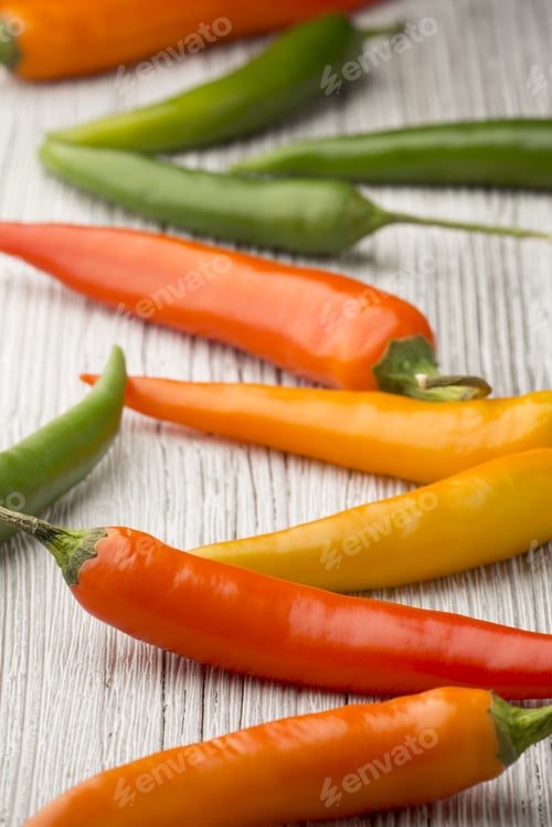 Preview: Chili Pepper Mix On A Wooden Background.