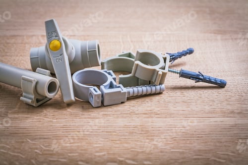 Preview: Polypropylene Fixators And Pipe With Clips Water Valve On Wooden Board