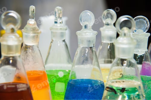 Preview: Chemical Industry Bulb With Blue Magenta Pink Liquid Lab Tubes Stand On The Table In The Laboratory