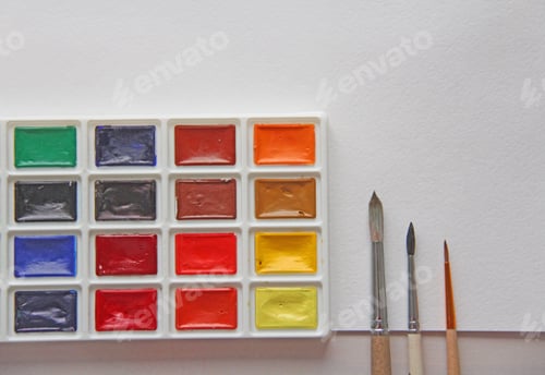 Preview: Vibrant Watercolor Paints and Brushes on White