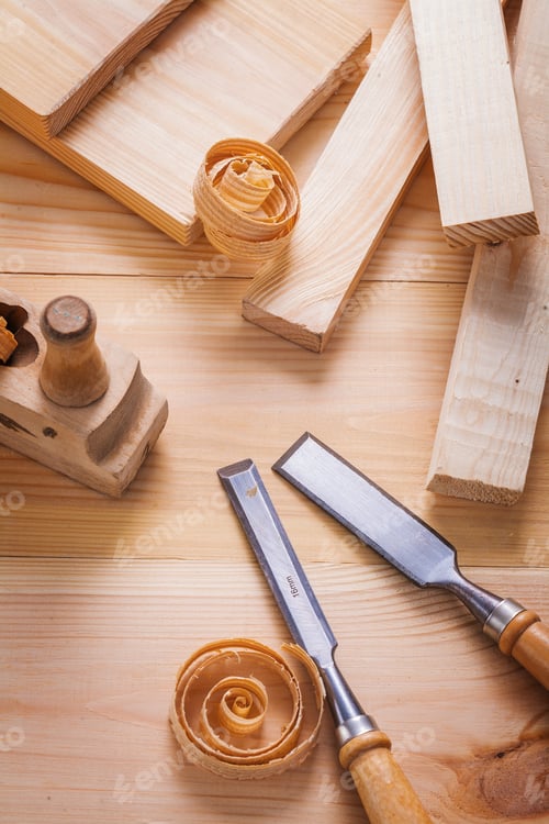 Preview: Composition Close Up View On Woodworkers Plane And Carpentry Chisels With Wooden Shavings On Boards