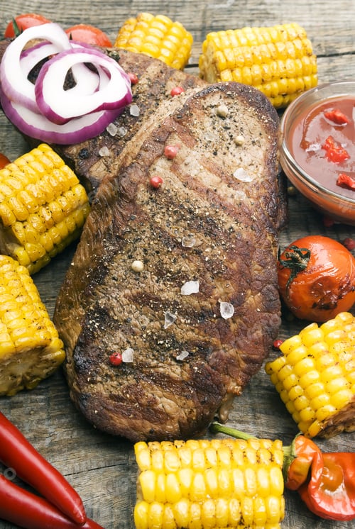 Preview: Delicious Beef Steaks On Wooden Table