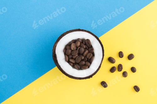 Preview: Composition With Coconut And Coffee Beans On The Bicolor Background. Top View. Copy Space.