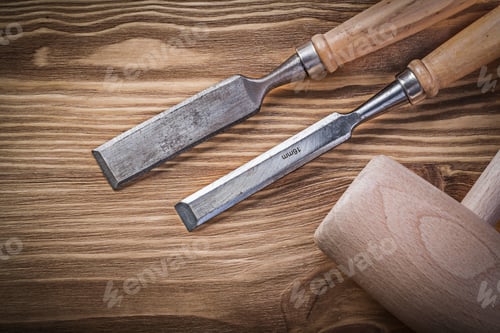Preview: Wooden Mallet Flat Chisels On Vintage Wood Board Construction Concept.