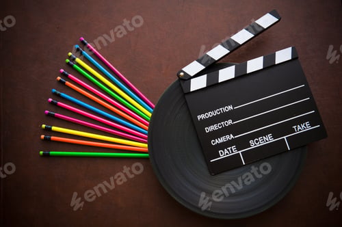 Preview: Wooden Writer Desktop With Colorful Pencil And Black Movie Clapper Board