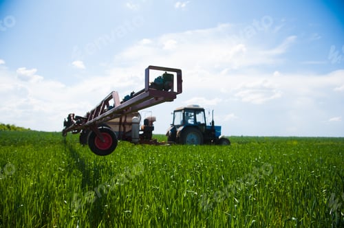 Preview: Tractor Spraying Pesticides Wheat Field With Sprayer At Spring