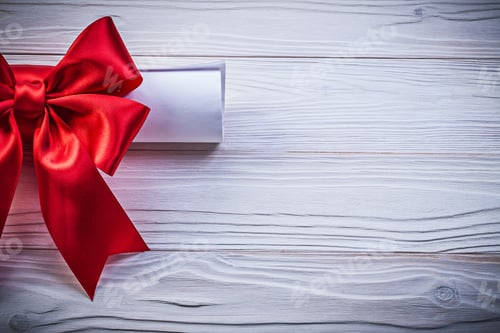 Preview: Paper Scroll With Red Bow On Wooden Board Holidays Concept.