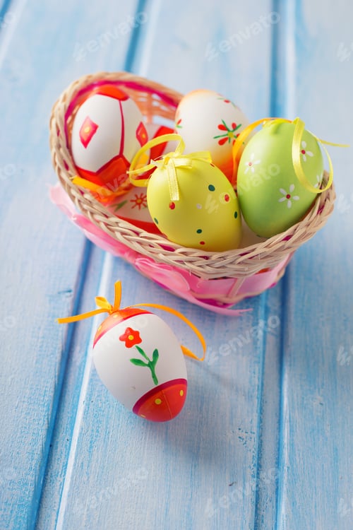 Preview: Colorful Easter Eggs In Bucket On Blue Painted Wooden Planks. Easter Background.