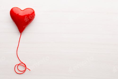 Preview: Happy Valentines Day. Red Ribbon Heart On A Wooden Background.