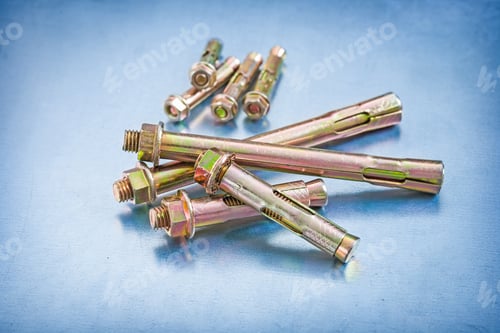 Preview: Set Of Metal Anchor Bolts With Construction Nuts On Metallic Background Repairing Concept
