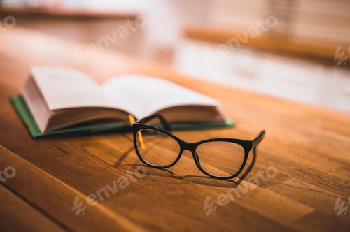 Preview: Open Book And Glasses On Table. Book And Glasses.