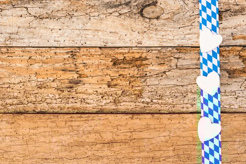 Preview: Rustic Background For Oktoberfest With Bavarian White-Blue Pattern And Hearts.