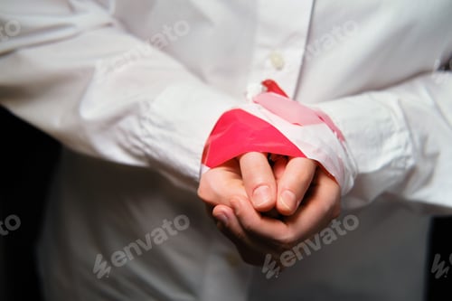 Preview: Bound Hands Of A Woman In A White Shirt, Close-Up. The Concept Of Isolation And Problems With