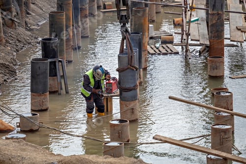 Preview: River Bank Revetment Construction Site. Welding Industrial Construction For Erosion Control.