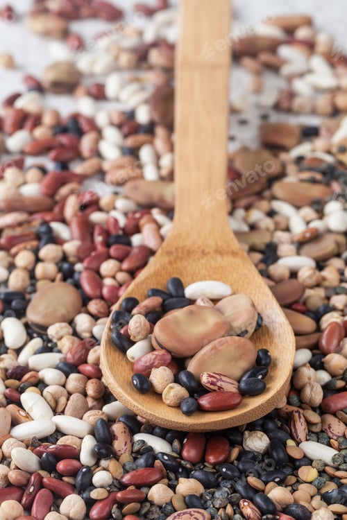 Preview: Assortment Of Various Raw Mixed Legumes With A Wooden Spoon