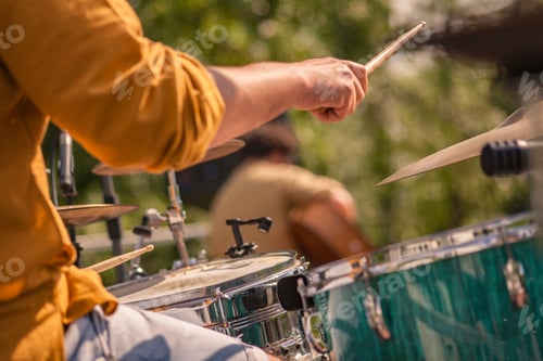Preview: Still Life Of The Hands Of A Drummer Playing Live Drums At A Concert