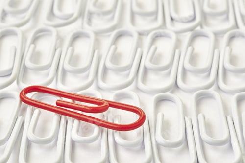 Preview: Detail Of One Red Paperclip Among White Paper Clips