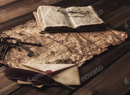 Preview: Bunch Of Old Keys, Book And Envelope On A Vintage Map