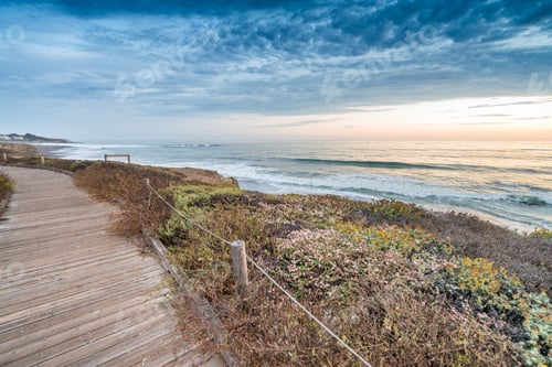 Preview: Wooden Path Along The Ocean At Dusk.