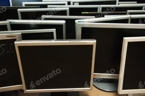 Preview: Stacks of Computer Monitors Awaiting Reuse or Disposal