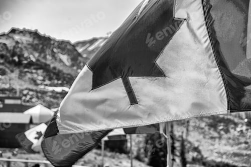 Preview: Waving Flag Against Mountain Background Black and White