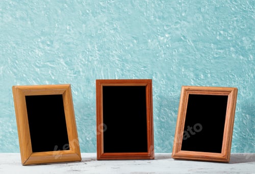 Preview: Wooden Photo Frames On Table, Blue Wall