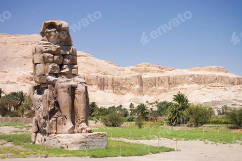 Preview: Ancient Pharaoh Statue And Column On Backlighted Sky Background