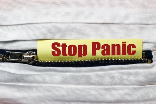 Preview: White Fabric With Zipper Close-Up. Sticker With Text Or Caption: " Stop Panic"