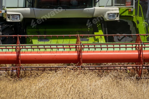 Preview: Harvester At Work On The Field Harvesting Ripe Wheat