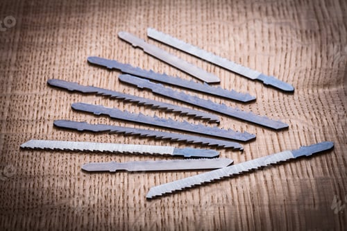 Preview: Blades For Electric Jigsaw On Vintage Wooden Board