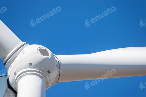 Preview: Wind Turbine Head Rotor Closeup Against Blue Sky Background