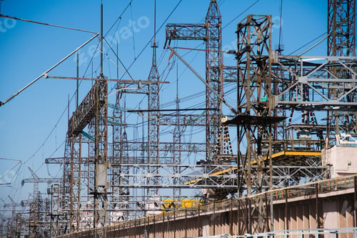 Preview: High-Voltage Power Transformer Substation. Power Plant Against A Blue Sky